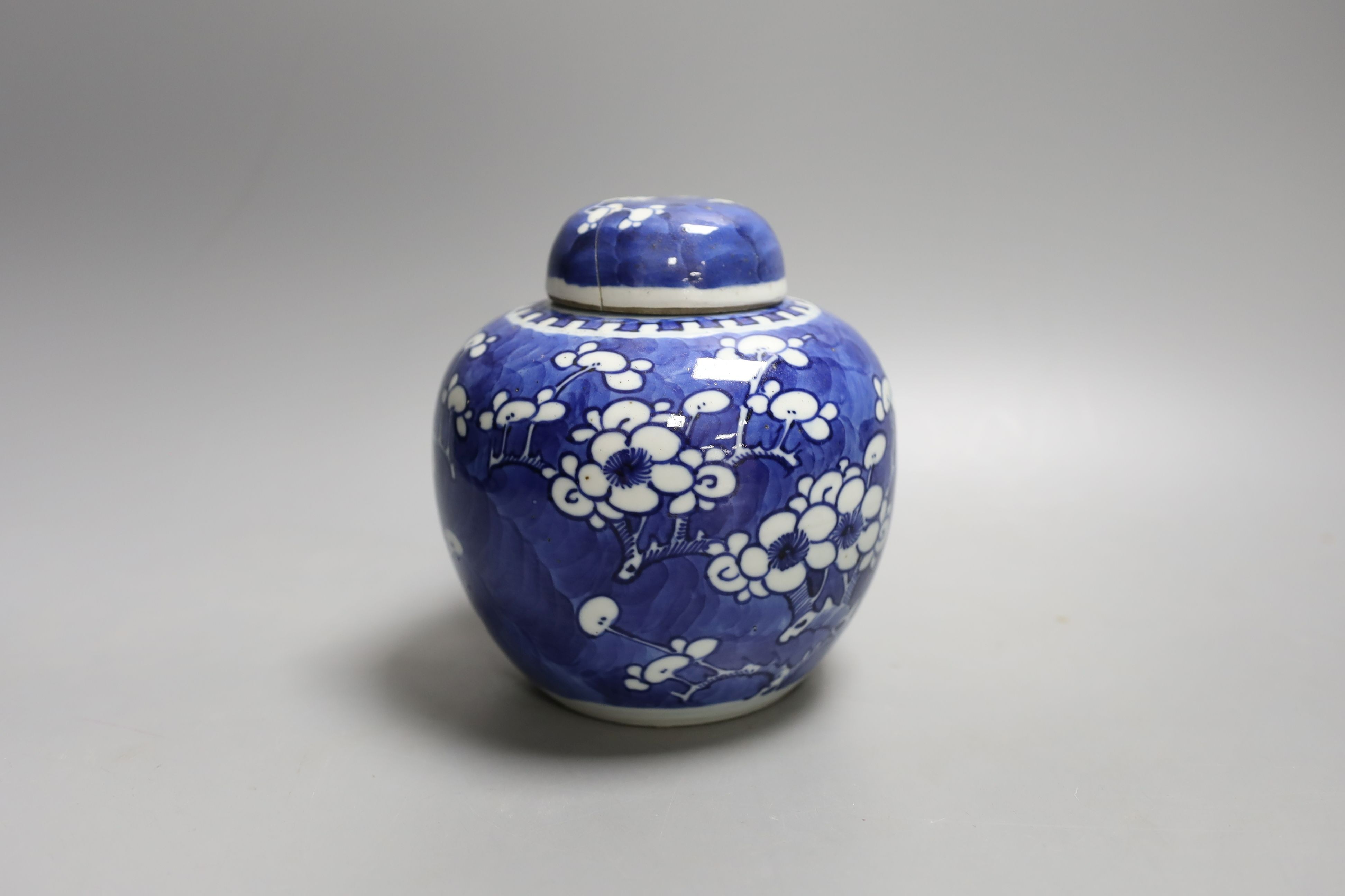 A Chinese blue and white jar and cover, Kangxi mark and of the period, 15cm tall